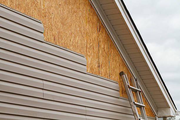 Professional Emergency Siding Repair technician working in Triangle, VA